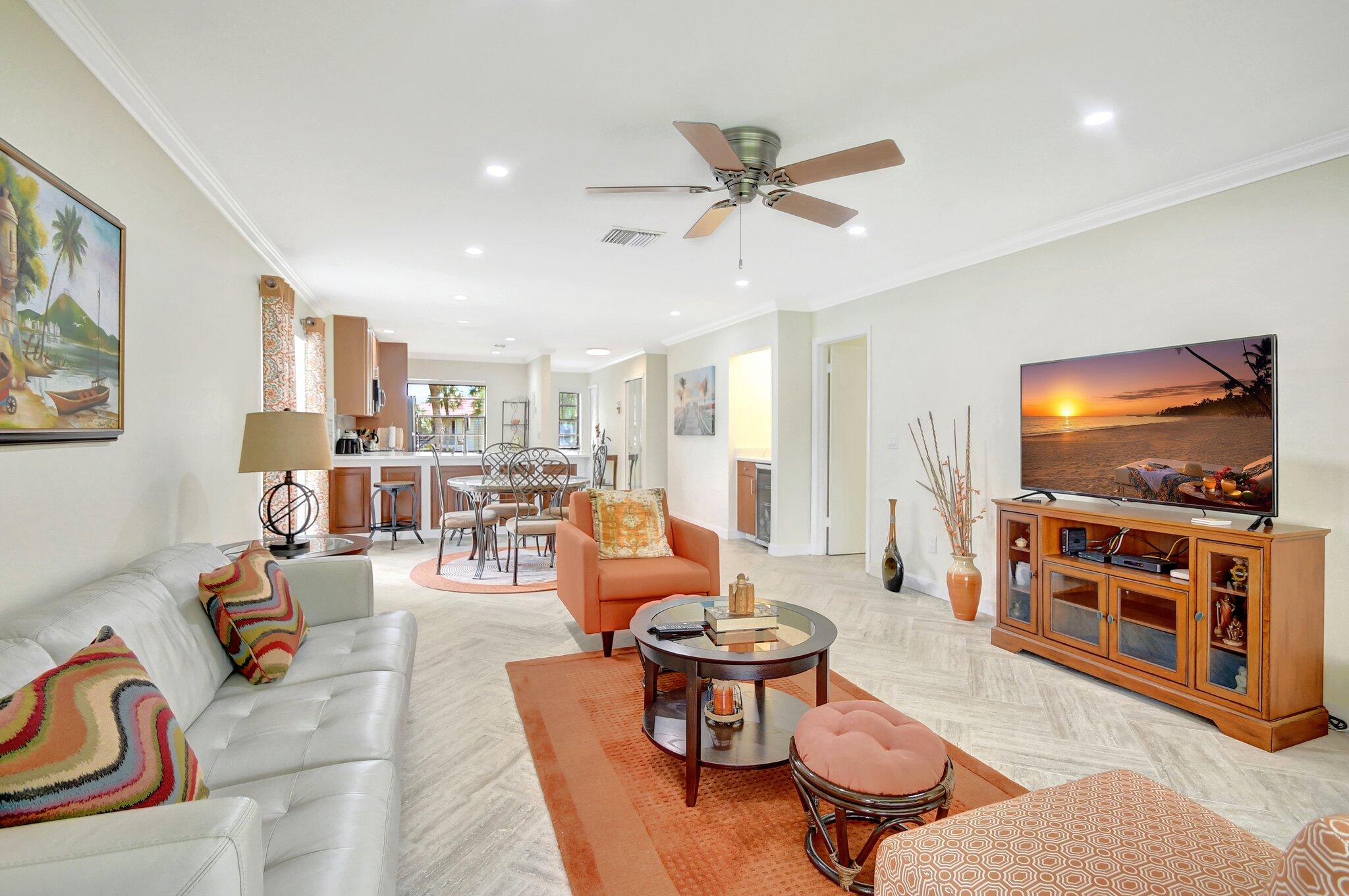 21209 Lago Circle, Unit 12G Boca Raton, FL 33433 - Photo 19 of 39 a living room with furniture and a flat screen tv