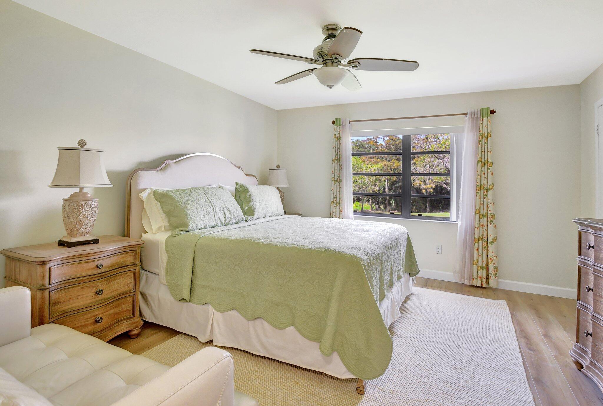 21209 Lago Circle, Unit 12G Boca Raton, FL 33433 - Photo 20 of 39 a bedroom with a bed and window