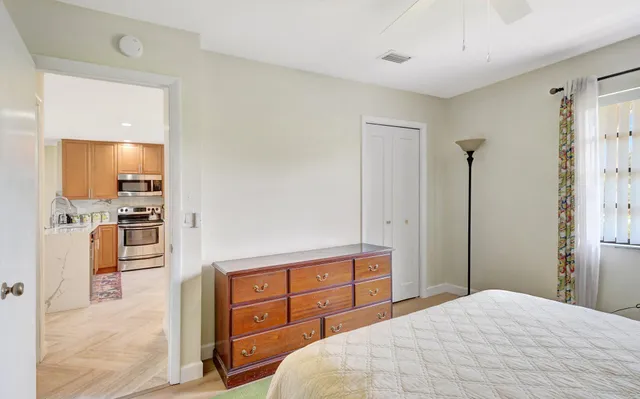 a bedroom with a bed and a view of bathroom
