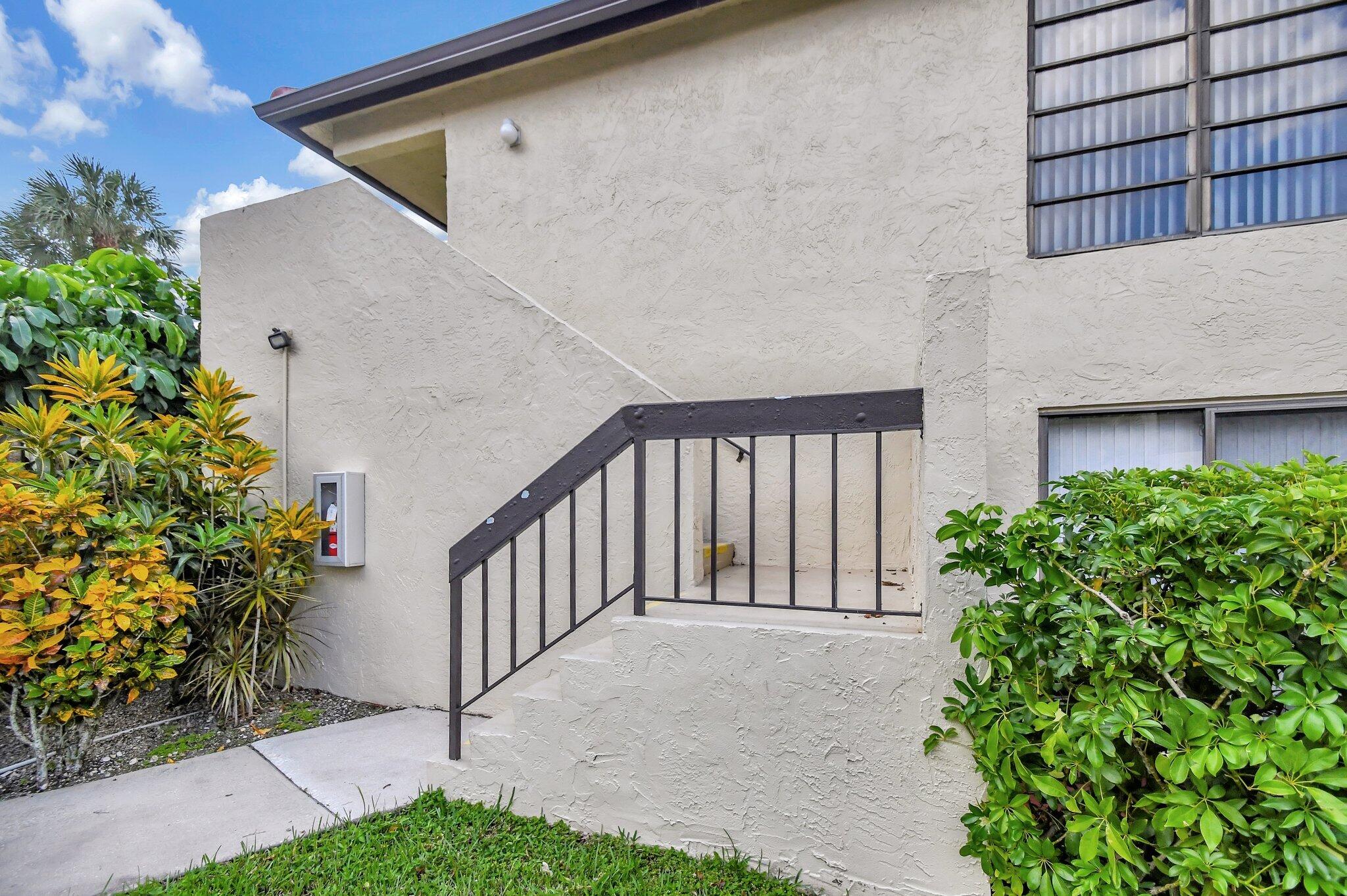 21209 Lago Circle, Unit 12G Boca Raton, FL 33433 - Photo 5 of 39 a view of balcony with small garden and plants