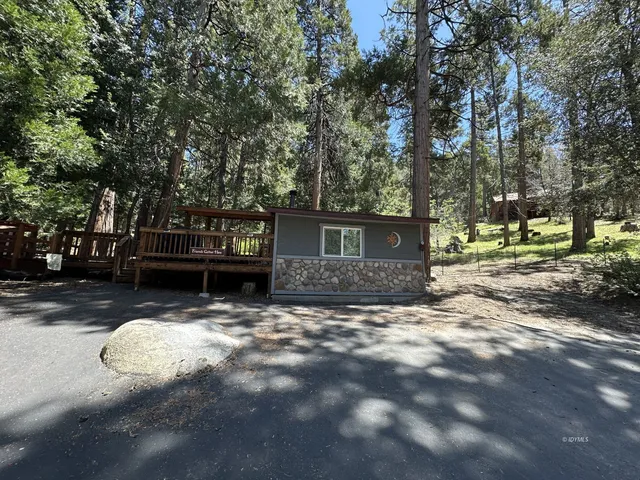 a view of house with yard