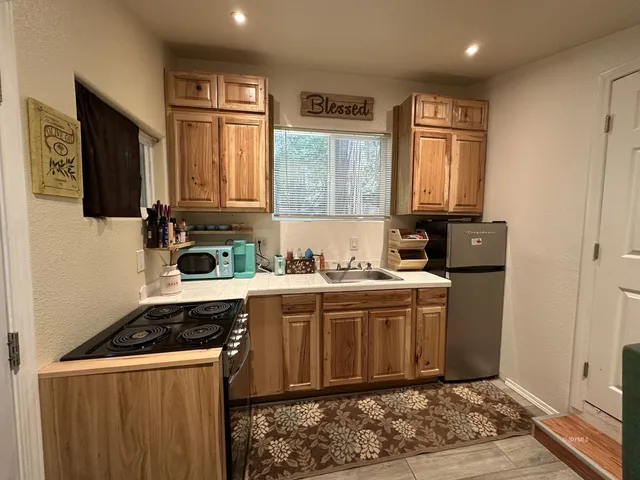 a kitchen with a stove and a sink