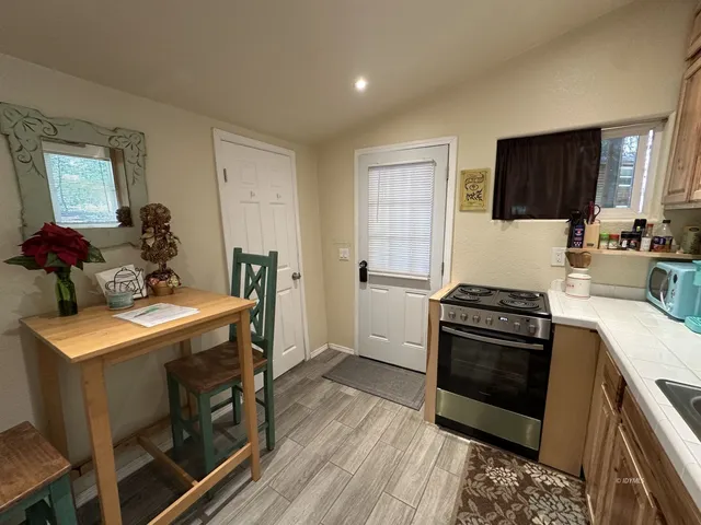 a kitchen with a stove and a refrigerator