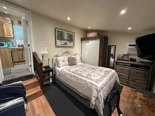 a bedroom with a bed and furniture