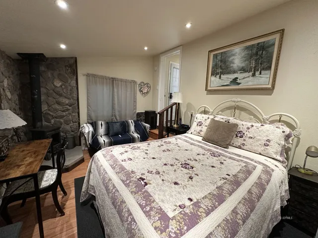 a bed room with a bed and a painting