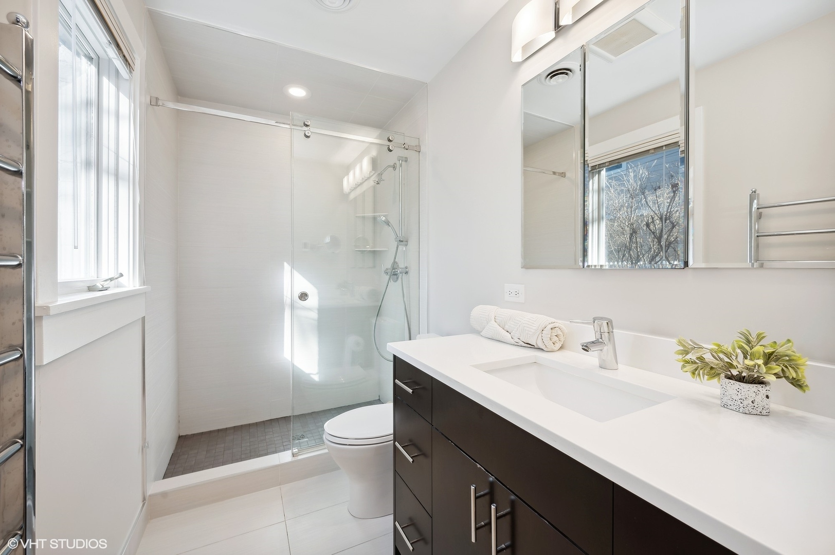 2048 Wagner Road Glenview, IL 60025 - Photo 15 of 37 a bathroom with a sink a toilet and a mirror