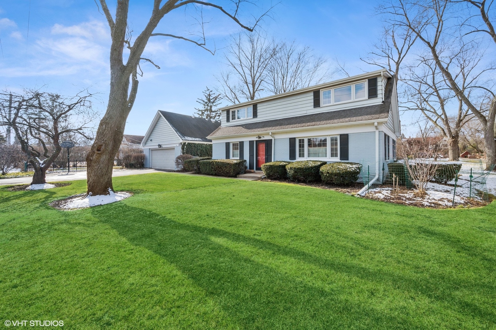 2048 Wagner Road Glenview, IL 60025 - Photo 2 of 37 a front view of house with yard and green space