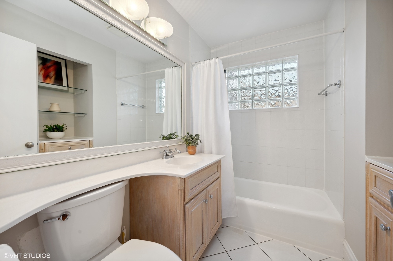 2048 Wagner Road Glenview, IL 60025 - Photo 21 of 37 a bathroom with a sink a toilet and shower