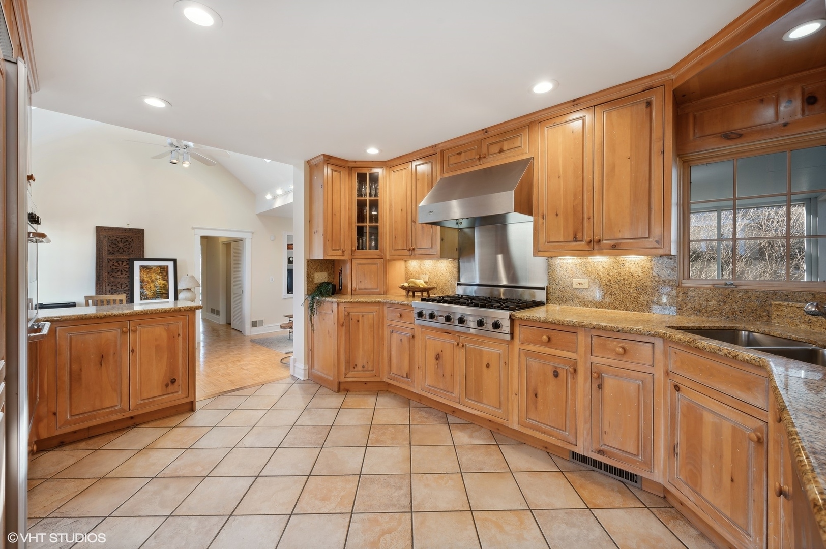 2048 Wagner Road Glenview, IL 60025 - Photo 9 of 37 a large kitchen with stainless steel appliances a sink and cabinets