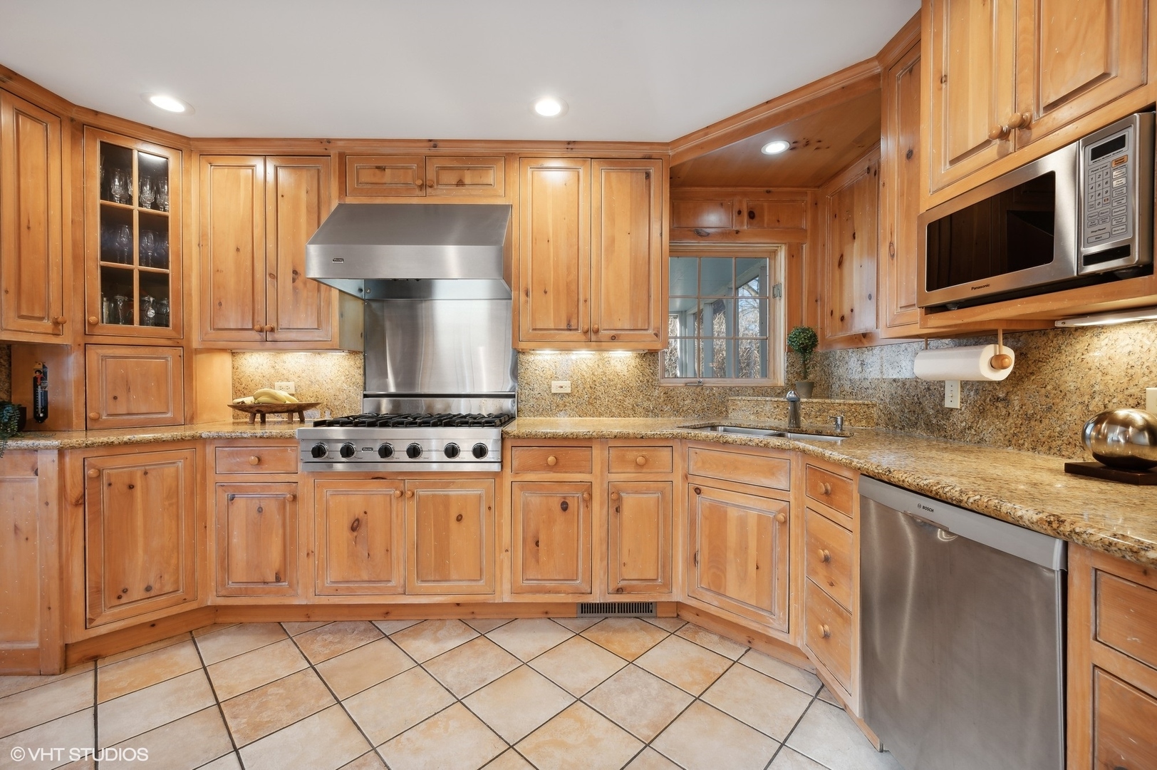 2048 Wagner Road Glenview, IL 60025 - Photo 10 of 37 a kitchen with stainless steel appliances granite countertop a stove top oven a sink and dishwasher