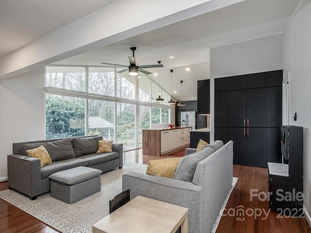 608 Robmont Road Charlotte, NC 28270 - Photo 13 of 25 a living room with furniture and a floor to ceiling window