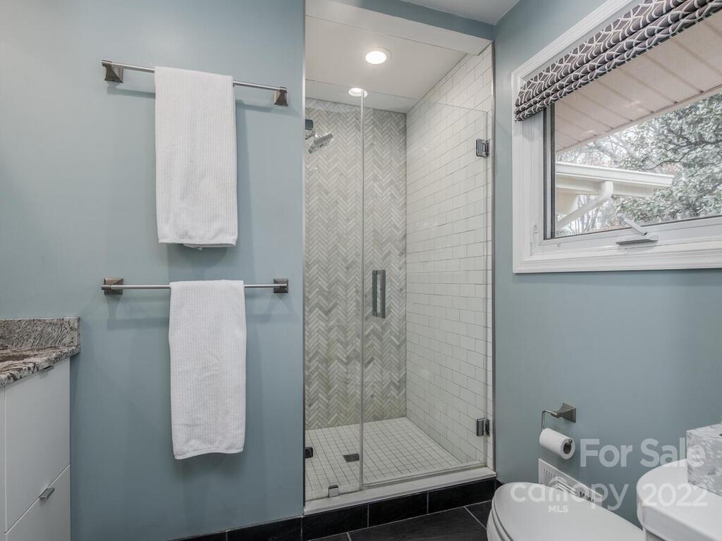 608 Robmont Road Charlotte, NC 28270 - Photo 16 of 25 a bathroom with a shower and toilet