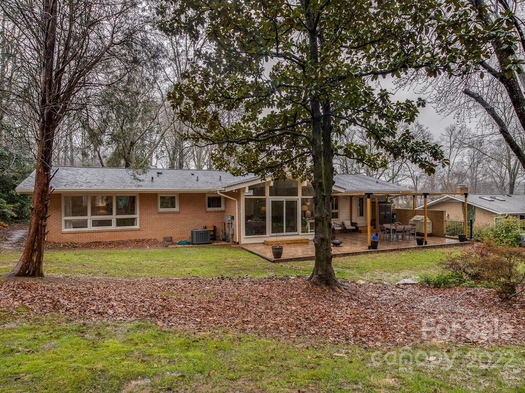 608 Robmont Road Charlotte, NC 28270 - Photo 25 of 25 a front view of a house with a garden