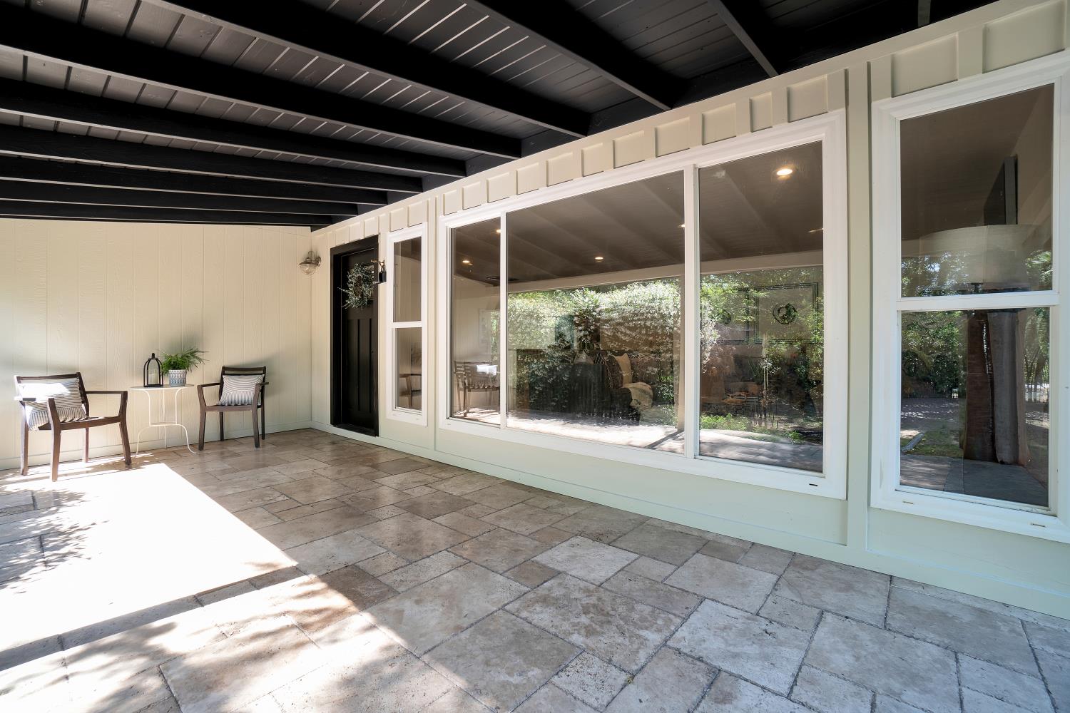 6299 Horseshoe Bar Road Loomis, CA 95650 - Photo 29 of 43 a view of a porch with chairs and floor to ceiling window with an outdoor space