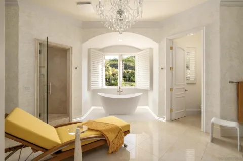 a living room with a bed and a table