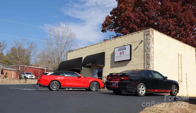 a view of a car parked in front of a house