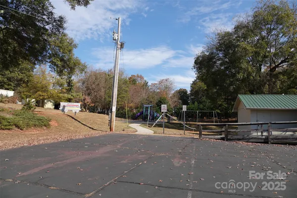 a view of a park with swings and slides