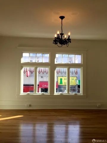 a view of a room with wooden flooring