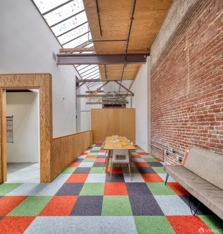 a room with a rug and a window