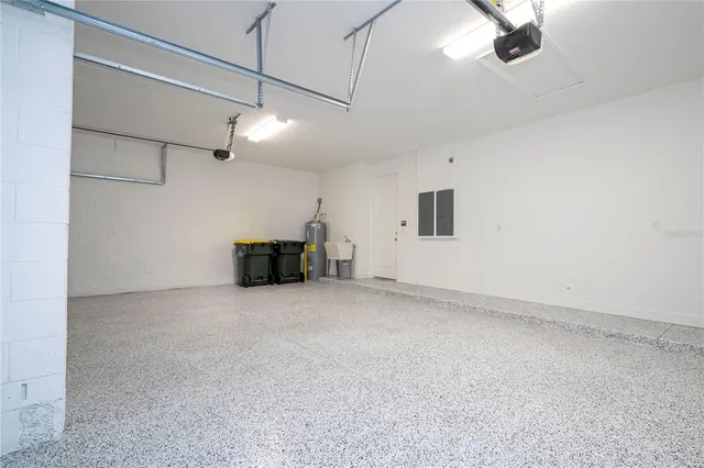 a spacious bedroom with a bed and a window