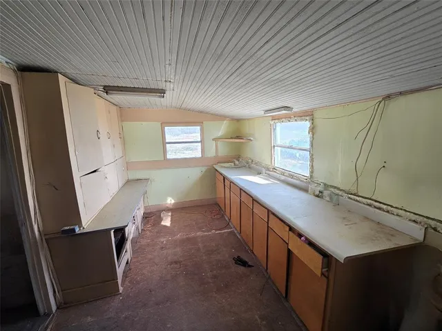 a kitchen with sink cabinets and outdoor seating