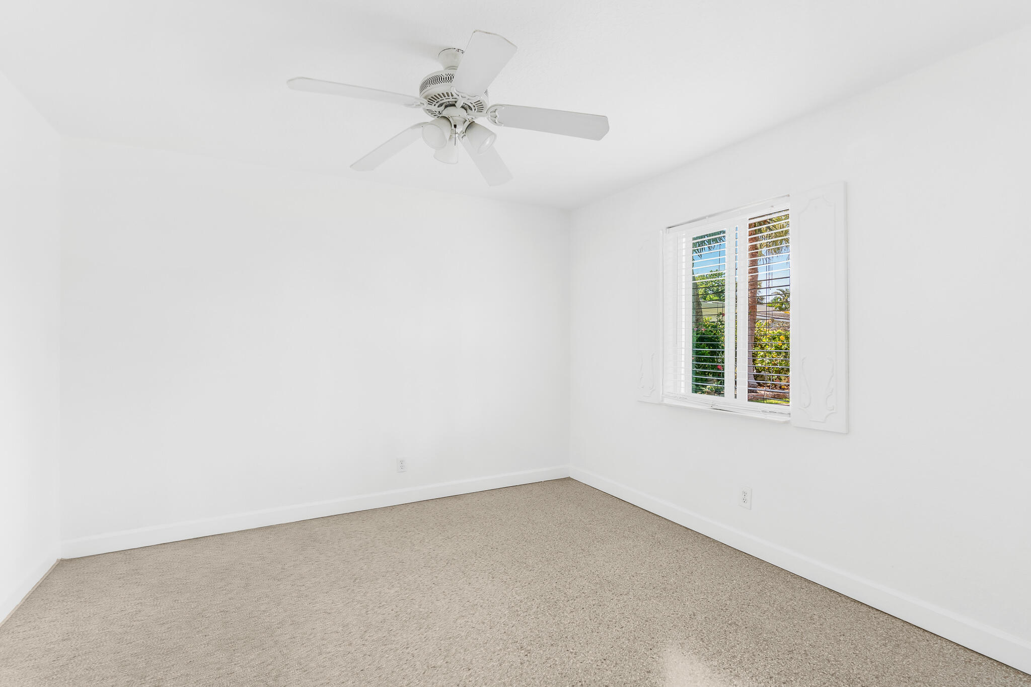 11 Tropical Drive, Unit 3 Ocean Ridge, FL 33435 - Photo 11 of 15 an empty room with a window