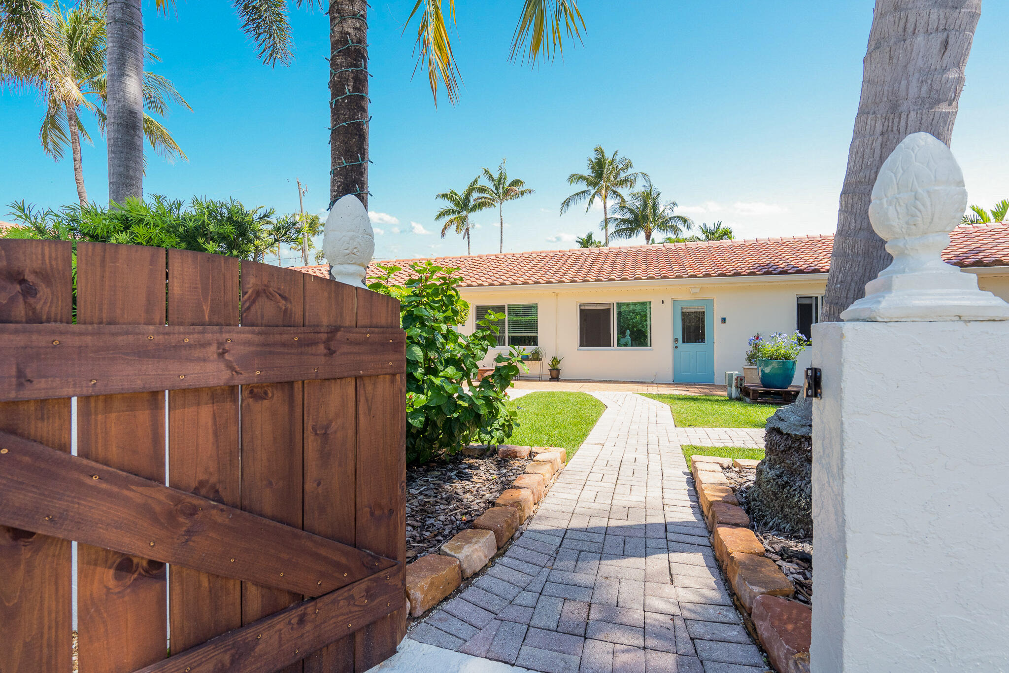 11 Tropical Drive, Unit 3 Ocean Ridge, FL 33435 - Photo 2 of 15 a view of a house with a yard