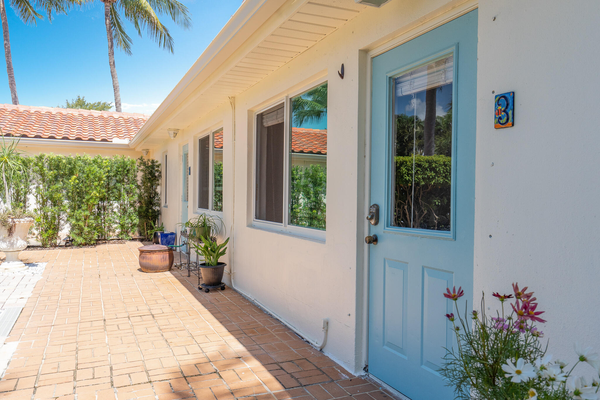 11 Tropical Drive, Unit 3 Ocean Ridge, FL 33435 - Photo 6 of 15 a porch with seating space