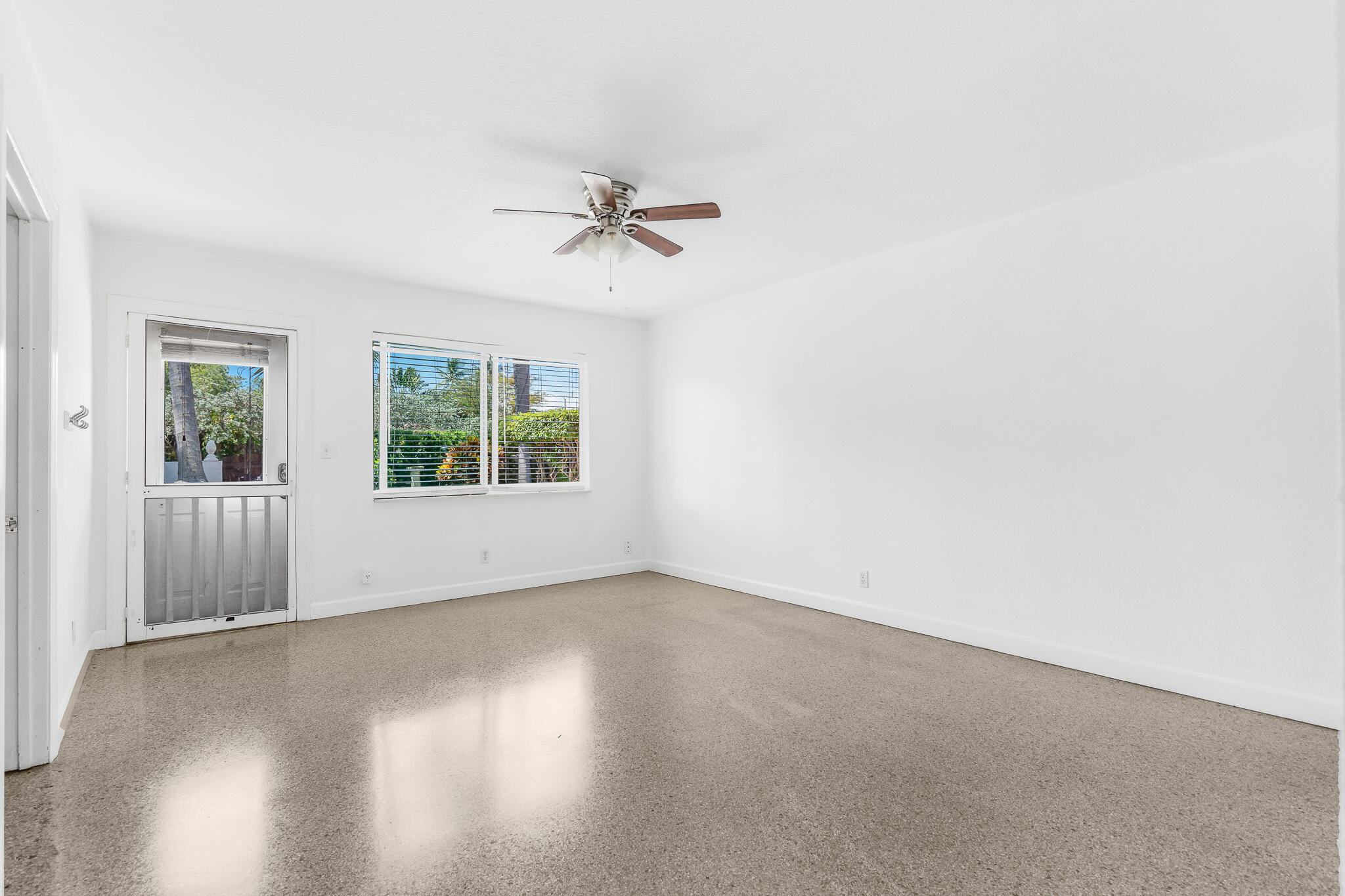 11 Tropical Drive, Unit 3 Ocean Ridge, FL 33435 - Photo 7 of 15 wooden floor in an empty room with a window