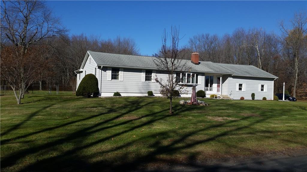 224 Scantic Road East Windsor, CT 06088 - Photo 1 of 1 a front view of a house with a yard table and chairs