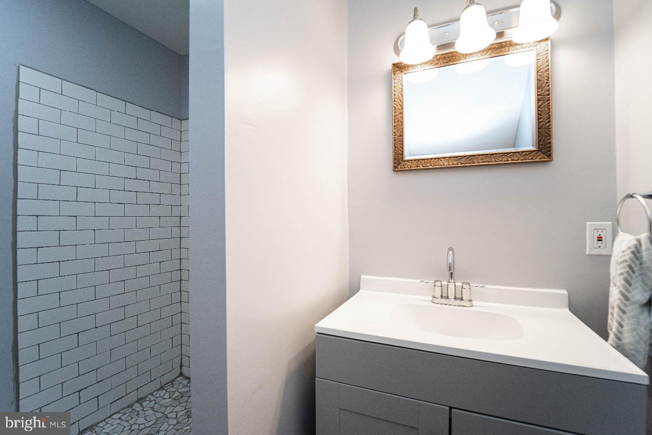 8033 Edgewater Avenue Rosedale, MD 21237 - Photo 18 of 23 Sleek bathroom with modern elegance.