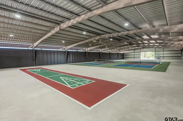 a en suite bathroom with a double vanity sink and a mirror