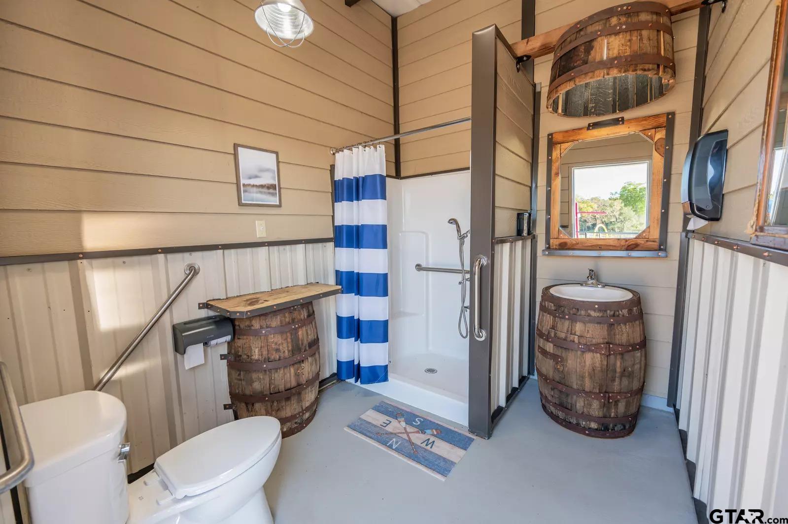 Lot 61 Rocco Drive Mount Pleasant, TX 75455 - Photo 19 of 24 a bathroom with a toilet and a shower