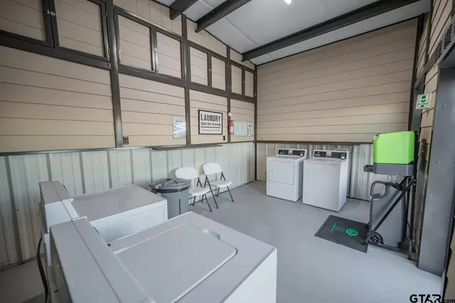 a view of a room with gym equipment and a large window