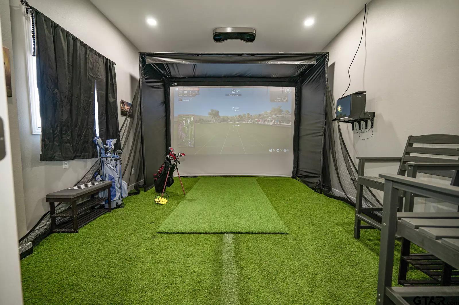 Lot 61 Rocco Drive Mount Pleasant, TX 75455 - Photo 21 of 24 a view of a room with gym equipment and a large window