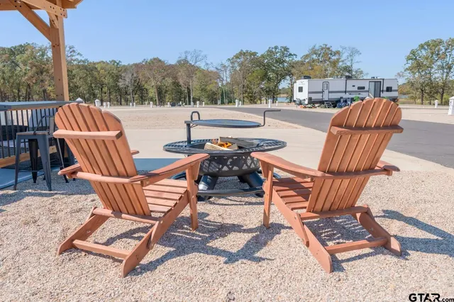 a view of a lake with houses in back