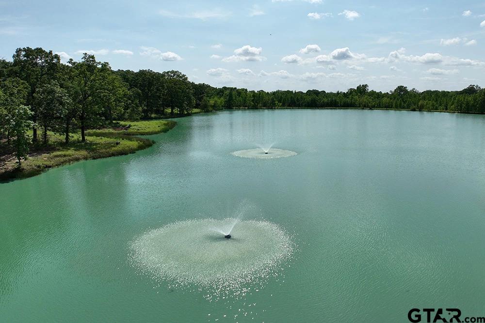 Lot 61 Rocco Drive Mount Pleasant, TX 75455 - Photo 5 of 24 a view of a lake with houses in back