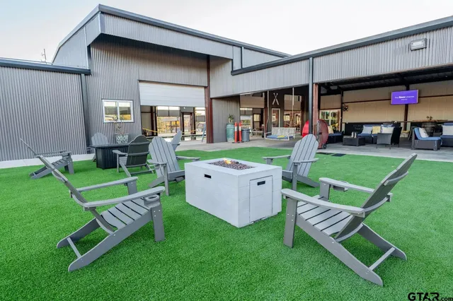 a table with chairs and a stove