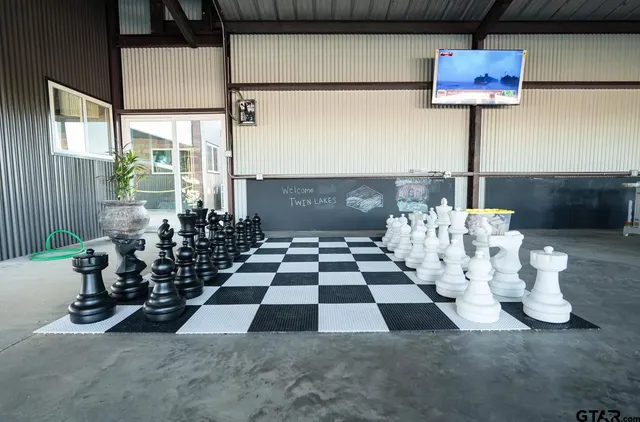 a view of swimming pool with a sitting area