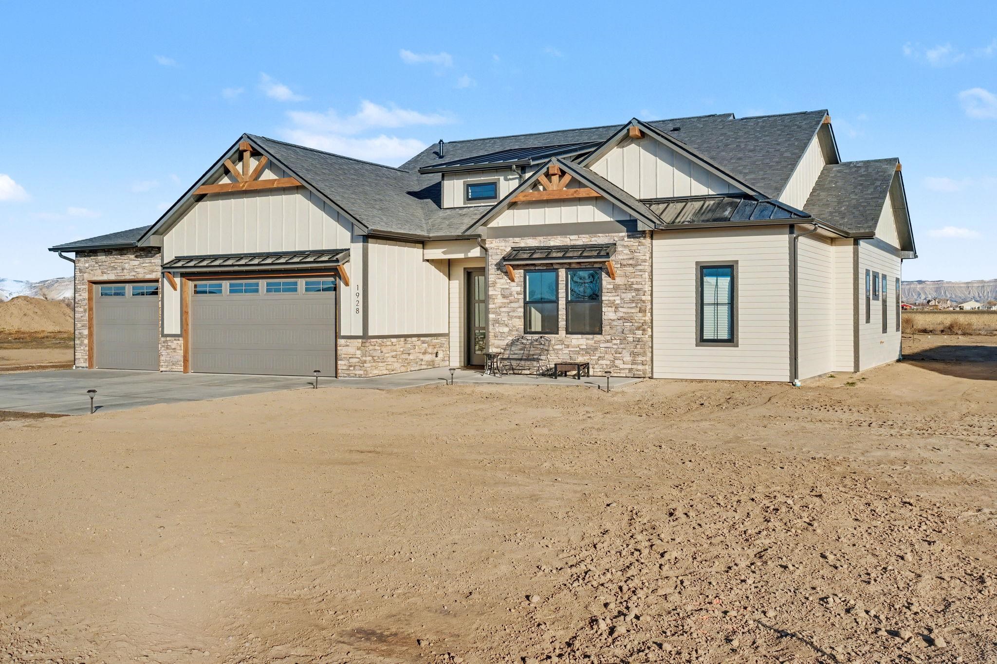 a front view of a house with a house and garage