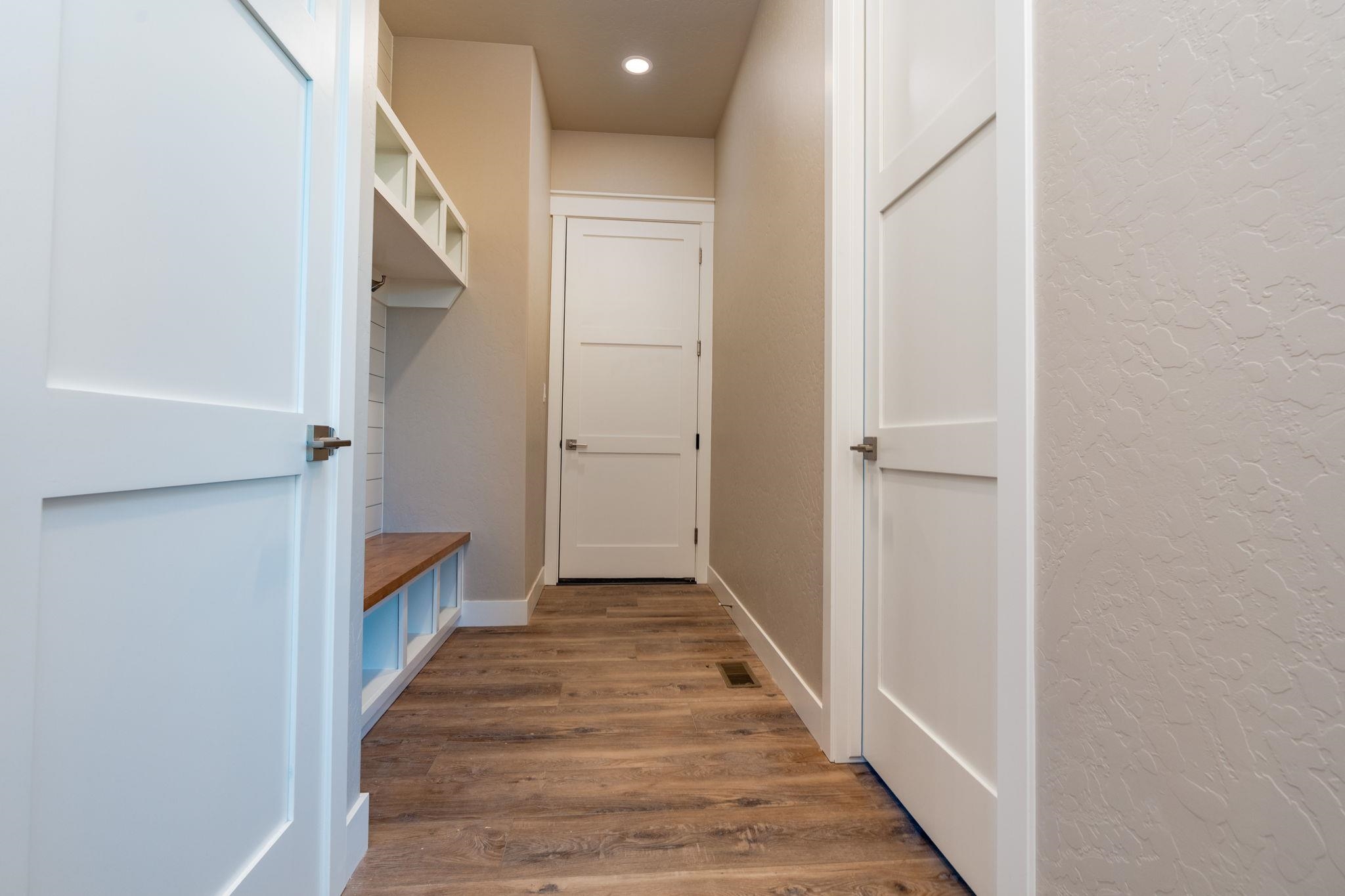 1928 K Road Fruita, CO 81521 - Photo 7 of 32 a view of a hallway with wooden floor and staircase