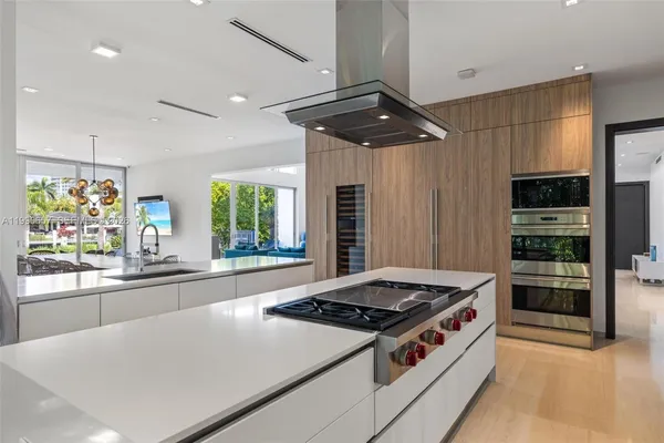 a kitchen with appliances cabinets and a sink