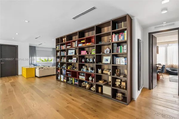 a bedroom with a bed and a table