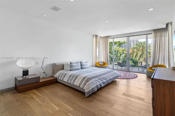 a balcony with furniture and a potted plant