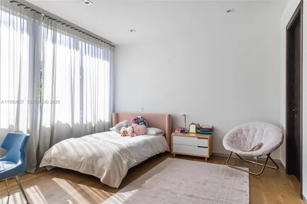 a bathroom with a toilet sink and shower