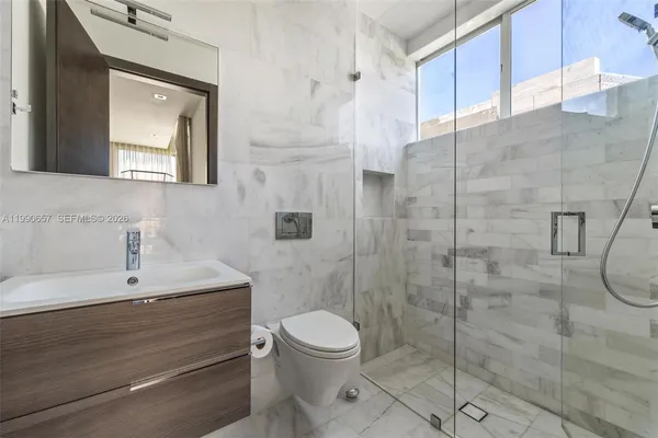 a view of a swimming pool with a patio and a yard