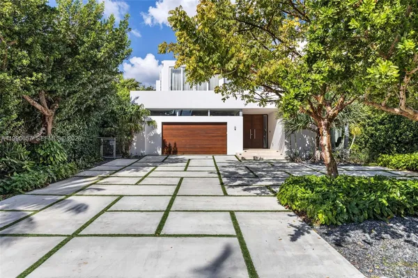 a balcony with furniture and a garden