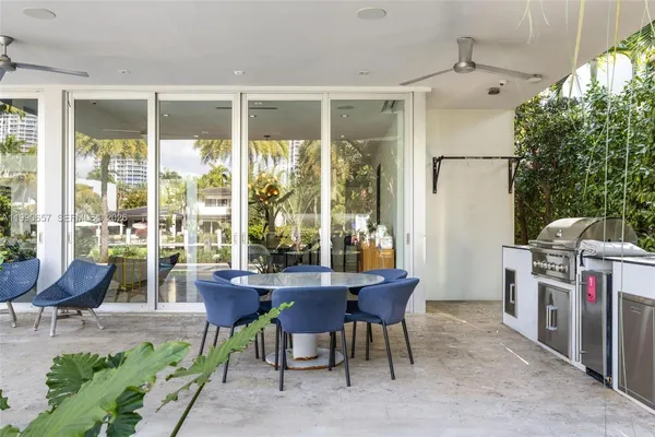 an aerial view of a city with lots of residential buildings ocean and boats