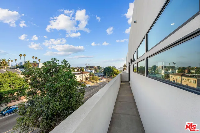 a view of a balcony with city view