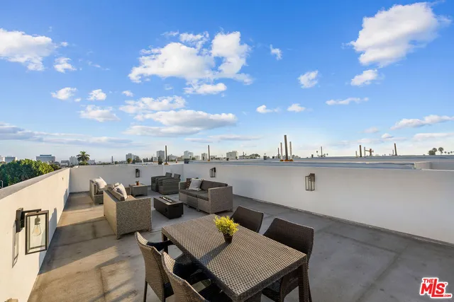 a view of a terrace with furniture